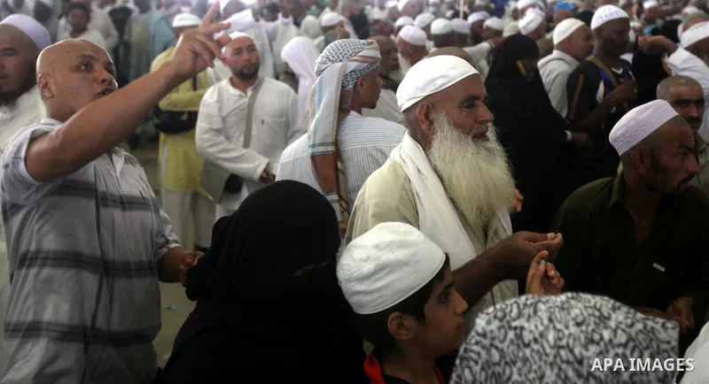 Muslim pilgrims walk to cast stones at a pillar, symbolizing the stoning of Satan, in a ritual called "Jamarat," a rite of the annual hajj, in Mina near the holy city of Mecca on October 05, 2014. The pilgrims perform a...