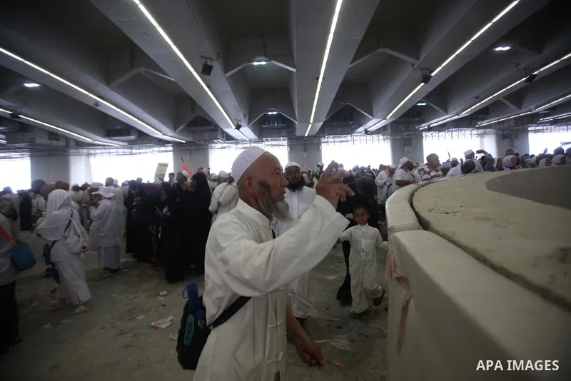 Muslim pilgrims arrive to cast stones at a pillar, symbolizing the stoning of Satan, in a ritual called "Jamarat," a rite of the annual hajj, in Mina near the holy city of Mecca on October 05, 2014. The pilgrims perform...