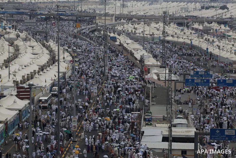 Muslim pilgrims walk to cast stones at a pillar, symbolizing the stoning of Satan, in a ritual called "Jamarat," a rite of the annual hajj, in Mina near the holy city of Mecca on October 05, 2014. The pilgrims perform a...