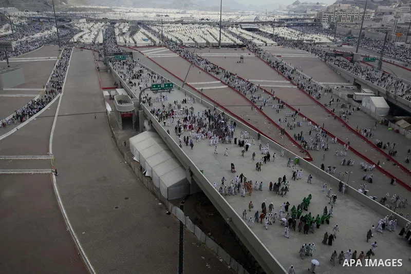 Muslim pilgrims walk to cast stones at a pillar, symbolizing the stoning of Satan, in a ritual called "Jamarat," a rite of the annual hajj, in Mina near the holy city of Mecca on October 05, 2014. The pilgrims perform a...