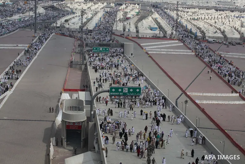 Muslim pilgrims walk to cast stones at a pillar, symbolizing the stoning of Satan, in a ritual called "Jamarat," a rite of the annual hajj, in Mina near the holy city of Mecca on October 05, 2014. The pilgrims perform a...