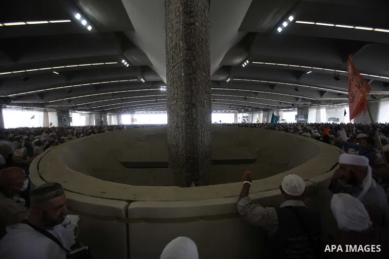 Muslim pilgrims arrive to cast stones at a pillar, symbolizing the stoning of Satan, in a ritual called "Jamarat," a rite of the annual hajj, in Mina near the holy city of Mecca on October 05, 2014. The pilgrims perform...