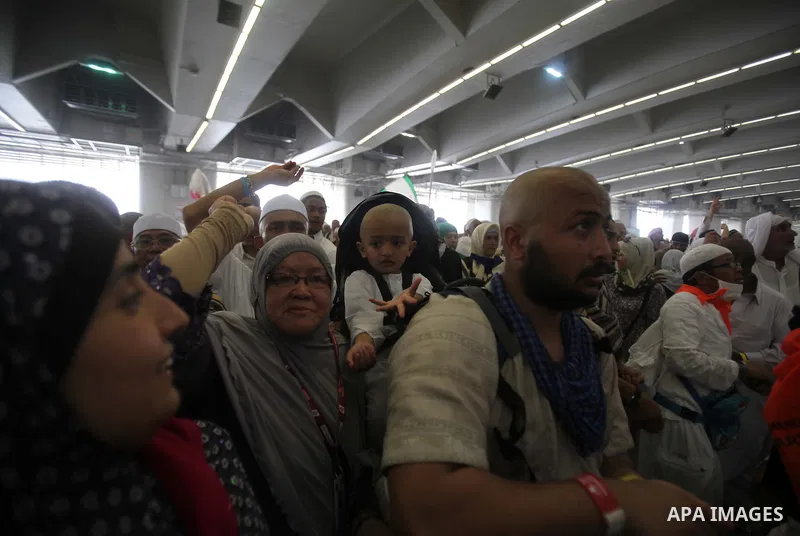 Muslim pilgrims arrive to cast stones at a pillar, symbolizing the stoning of Satan, in a ritual called "Jamarat," a rite of the annual hajj, in Mina near the holy city of Mecca on October 05, 2014. The pilgrims perform...