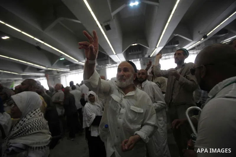 Muslim pilgrims arrive to cast stones at a pillar, symbolizing the stoning of Satan, in a ritual called "Jamarat," a rite of the annual hajj, in Mina near the holy city of Mecca on October 05, 2014. The pilgrims perform...
