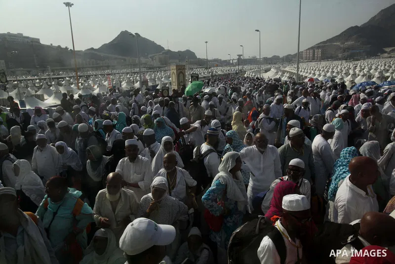 Muslim pilgrims walk to cast stones at a pillar, symbolizing the stoning of Satan, in a ritual called "Jamarat," a rite of the annual hajj, in Mina near the holy city of Mecca on October 06, 2014. The pilgrims perform a...
