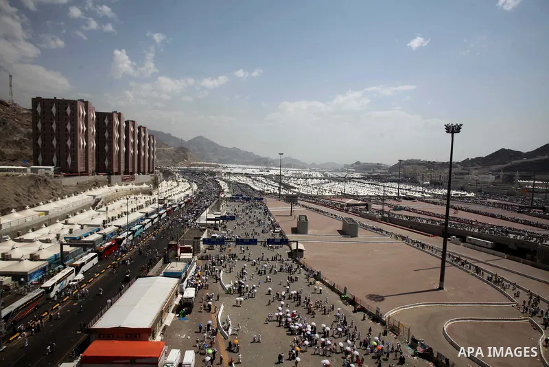 Muslim pilgrims walk to cast stones at a pillar, symbolizing the stoning of Satan, in a ritual called "Jamarat," a rite of the annual hajj, in Mina near the holy city of Mecca on October 06, 2014. The pilgrims perform a...