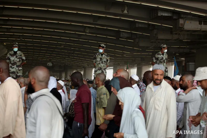 Muslim pilgrims arrive to cast stones at a pillar, symbolizing the stoning of Satan, in a ritual called "Jamarat," a rite of the annual hajj, in Mina near the holy city of Mecca on October 06, 2014. The pilgrims perform...