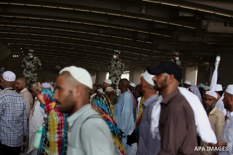 Muslim pilgrims arrive to cast stones at a pillar, symbolizing the stoning of Satan, in a ritual called "Jamarat," a rite of the annual hajj, in Mina near the holy city of Mecca on October 06, 2014. The pilgrims perform...