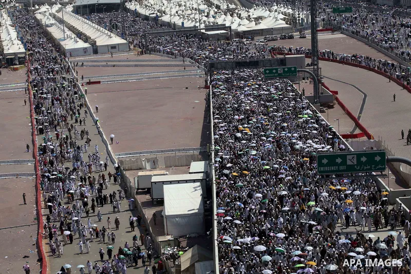Muslim pilgrims walk to cast stones at a pillar, symbolizing the stoning of Satan, in a ritual called "Jamarat," a rite of the annual hajj, in Mina near the holy city of Mecca on October 06, 2014. The pilgrims perform a...