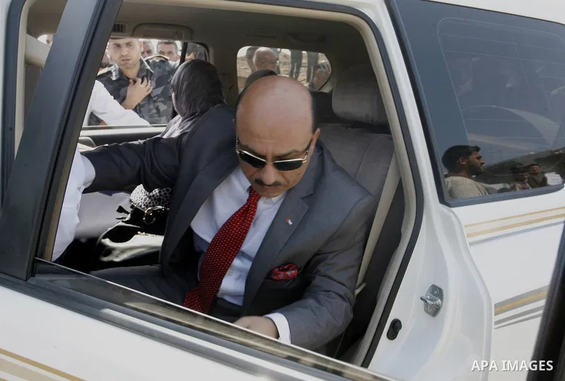Palestinian minister of housing Mufid al-Hasayna rides his car during the visit of Prime Minister Rami Hamdallah to the Beit Hanoun in the northern Gaza Strip on October 9, 2014. The Palestinian unity government which to...