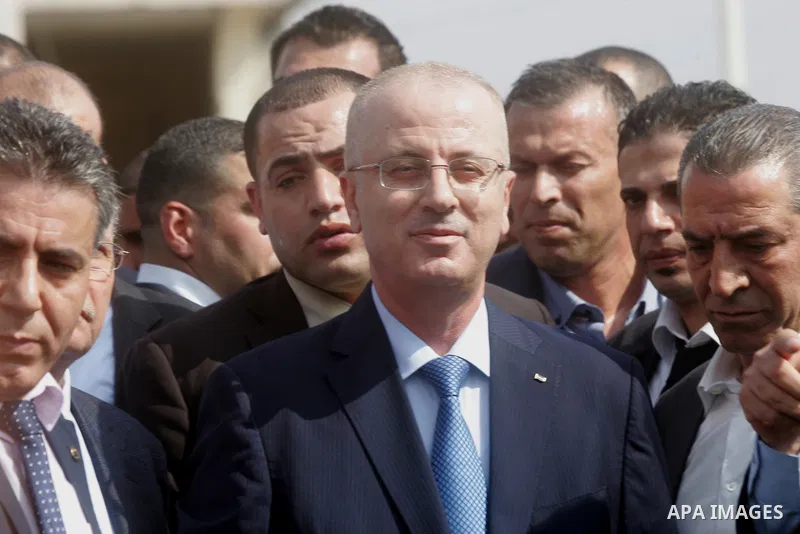 Palestinian Prime Minister Rami Hamdallah speaks to media upon his arrival to the Gaza Strip at Erez Crossing checkpoint, northern Gaza Strip on October 9, 2014. The Palestinian unity government which took the oath of of...