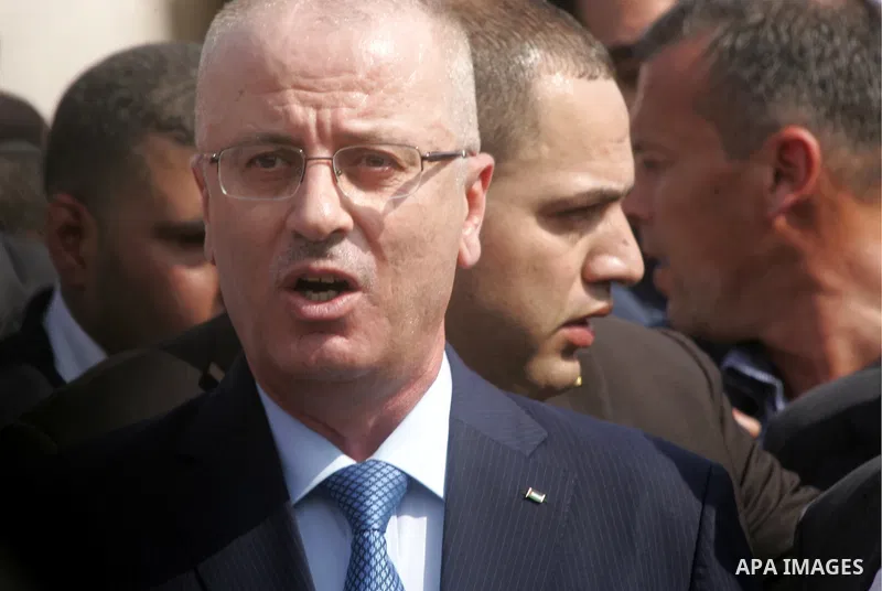 Palestinian Prime Minister Rami Hamdallah speaks to media upon his arrival to the Gaza Strip at Erez Crossing checkpoint, northern Gaza Strip on October 9, 2014. The Palestinian unity government which took the oath of of...