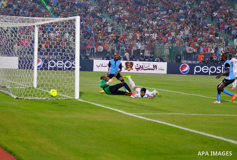 Egyptian players compete against with Botswana players during the qualifying match of 2015 Africa Cup soccer match, in Cairo, capital of Egypt, on Oct. 15, 2014. Egypt won the match with 2-0. Photo by Amr Sayed