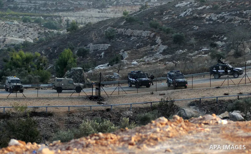 Israeli security forces take position during clashes with Palestinian protesters at a protest to show solidarity with al-Aqsa mosque, outside Israel's Ofer military prison near the West Bank city of Ramallah October 17,...