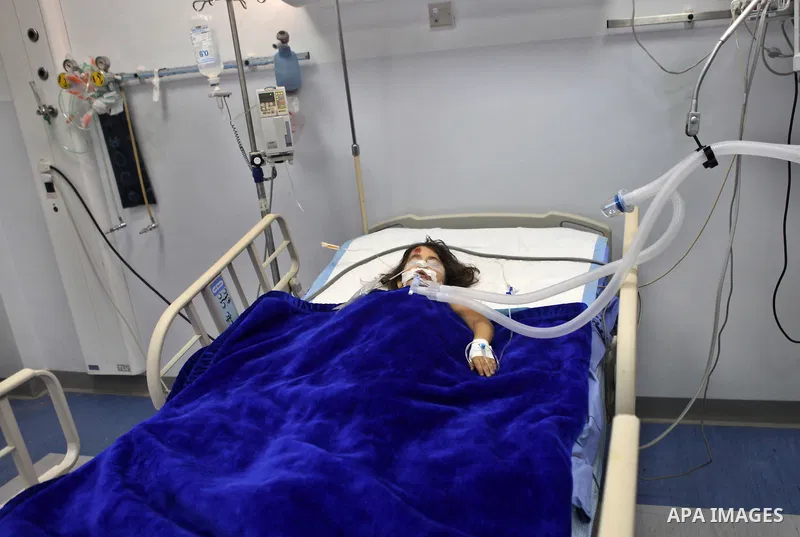 Palestinian kindergarten girl Toleen Omar Asfour, 5, lies at a hospital bed in the West Bank city of Ramallah, October 19, 2014. A kindergarten girl Sunday died of her wounds, while Asfour was seriously injured after an...