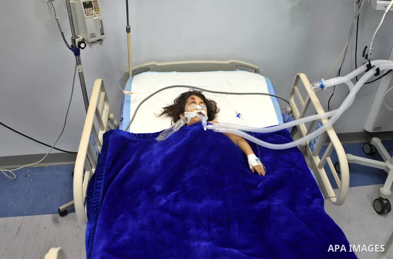 Palestinian kindergarten girl Toleen Omar Asfour, 5, lies at a hospital bed in the West Bank city of Ramallah, October 19, 2014. A kindergarten girl Sunday died of her wounds, while Asfour was seriously injured after an...
