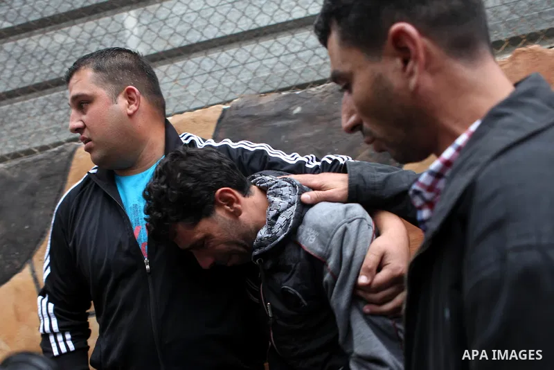 The father of Palestinian kindergarten girl Inas Shawkat Khalil, 5, reacts after his daughter died at a hospital in the West Bank city of Ramallah, October 19, 2014. Khalil died Sunday of her wounds, while another girl w...
