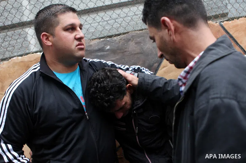 The father of Palestinian kindergarten girl Inas Shawkat Khalil, 5, reacts after his daughter died at a hospital in the West Bank city of Ramallah, October 19, 2014. Khalil died Sunday of her wounds, while another girl w...