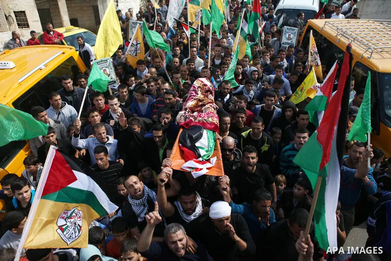 Palestinians carry the body of kindergarten girl Inas Shawkat Khalil, 5, during her funeral in the West Bank village of Sinjel north of Ramallah, October 20, 2014. Khalil died Sunday of her wounds, while another girl was...