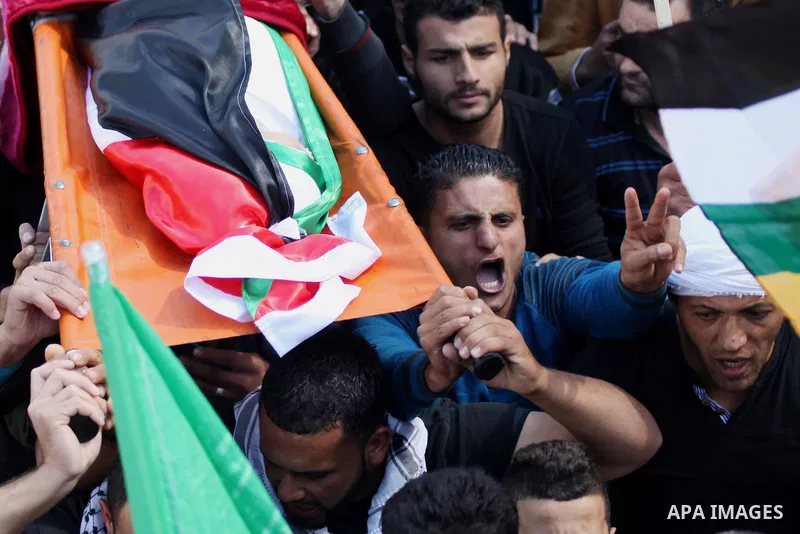 Palestinians carry the body of kindergarten girl Inas Shawkat Khalil, 5, during her funeral in the West Bank village of Sinjel north of Ramallah, October 20, 2014. Khalil died Sunday of her wounds, while another girl was...