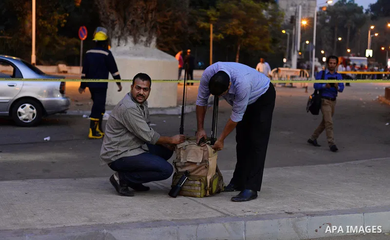 Members of Egyptian security forces monitor near Cairo University after a bomb exploded outside the main gate wounding at least nine people including a senior officer on October 22, 2014. The assistant police chief of Ca...
