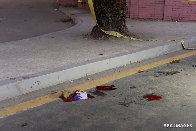Blood trails are seen on a street at the scene of an explosion near Cairo University in Cairo October 22, 2014. The assistant police chief of Cairo's Giza district was moderately wounded, as were six policemen stationed...