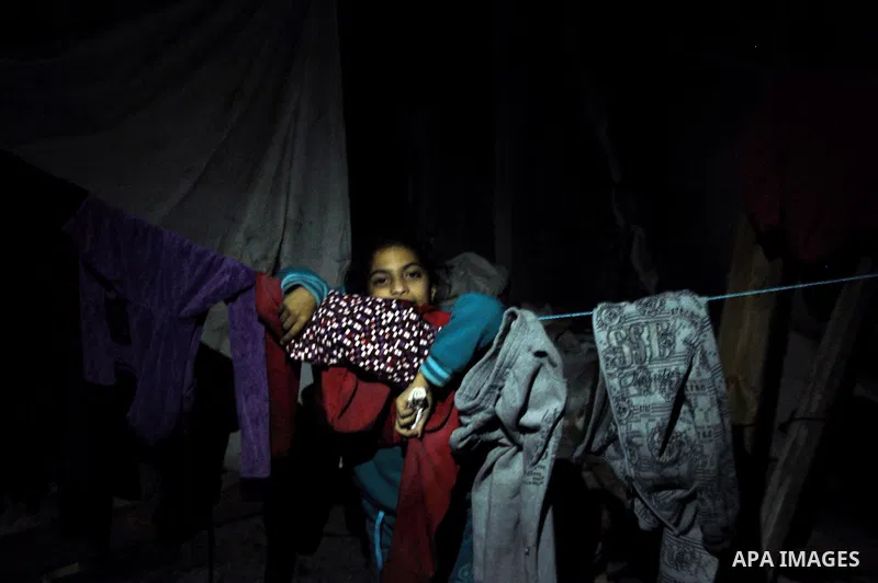 A Palestinian girl plays at her destroyed house in al-Shejaiya neighbourhood in the east of Gaza City, October 23, 2014. With the cold days of winter approaching, more than 100,000 Gaza residents are still homeless. Acco...