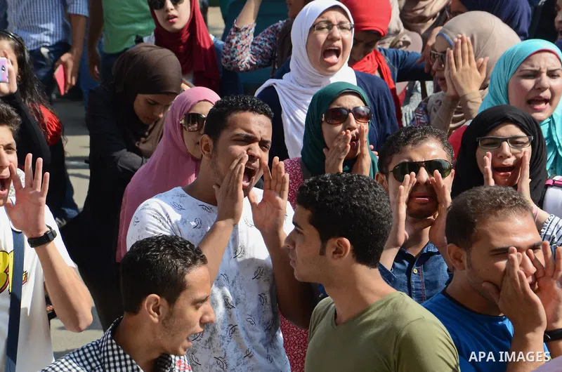 Egyptian students shot slogans during a demonstration to demand their rights at Cairo University, in Cairo, Eygpt, on Oct. 26, 2014. Photo by Amr Sayed