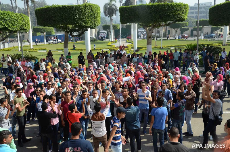 Egyptian students shot slogans during a demonstration to demand their rights at Cairo University, in Cairo, Eygpt, on Oct. 26, 2014. Photo by Amr Sayed