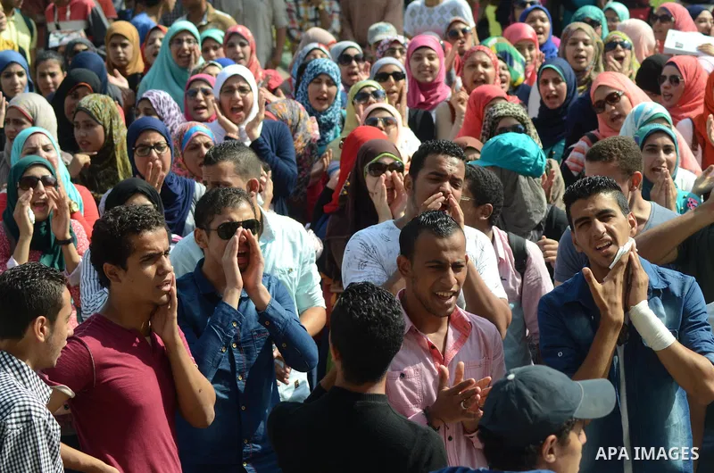 Egyptian students shot slogans during a demonstration to demand their rights at Cairo University, in Cairo, Eygpt, on Oct. 26, 2014. Photo by Amr Sayed