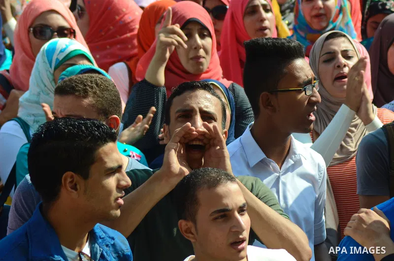 Egyptian students shot slogans during a demonstration to demand their rights at Cairo University, in Cairo, Eygpt, on Oct. 26, 2014. Photo by Amr Sayed