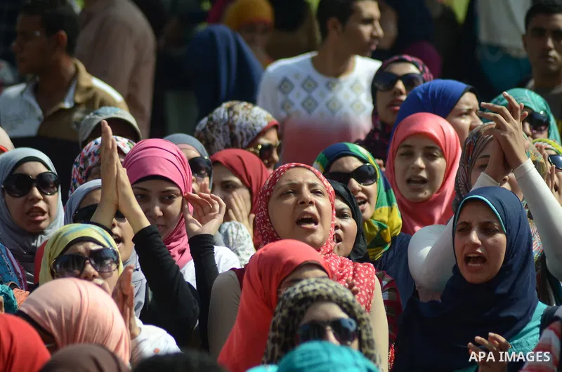 Egyptian students shot slogans during a demonstration to demand their rights at Cairo University, in Cairo, Eygpt, on Oct. 26, 2014. Photo by Amr Sayed