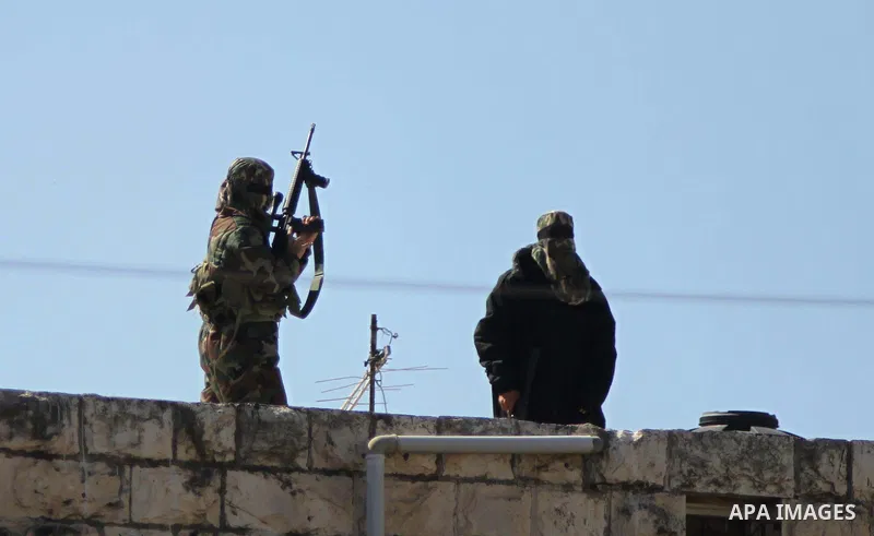 Palestinian militants take part in the funeral of Palestinian-American youth Orwah Hammad, whom medics said was killed by Israeli forces, in the West Bank village of Silwad near Ramallah October 26, 2014. Israeli forces...