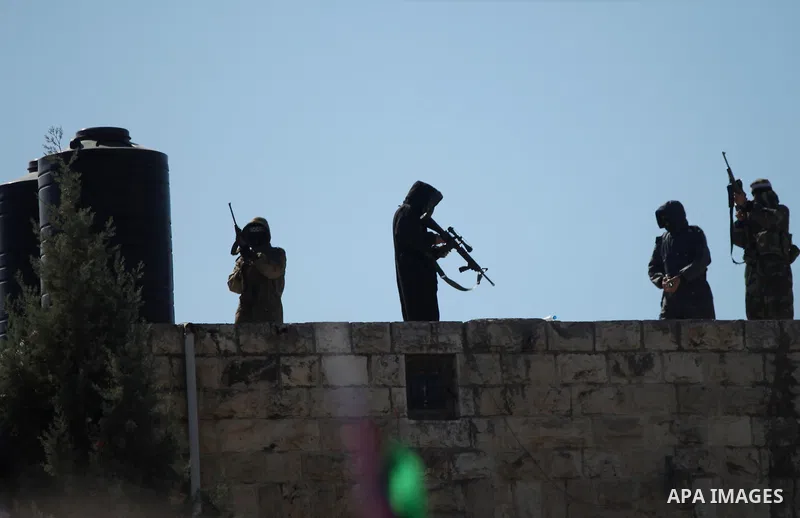 Palestinian militants take part in the funeral of Palestinian-American youth Orwah Hammad, whom medics said was killed by Israeli forces, in the West Bank village of Silwad near Ramallah October 26, 2014. Israeli forces...