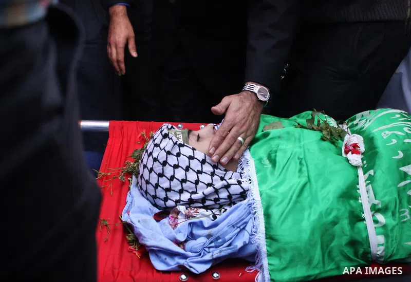 The Father of Palestinian-American youth Orwah Hammad, whom medics said was killed by Israeli forces, mourns during his funeral in the West Bank village of Silwad near Ramallah October 26, 2014. Israeli forces shot and k...