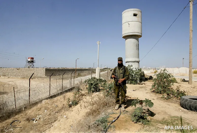 A Palestinian security officer patrols the Palestinian side of the Rafah border crossing in the southern Gaza Strip with Egypt (background) on October 26, 2014. The decision was taken to close the Rafah crossing into the...