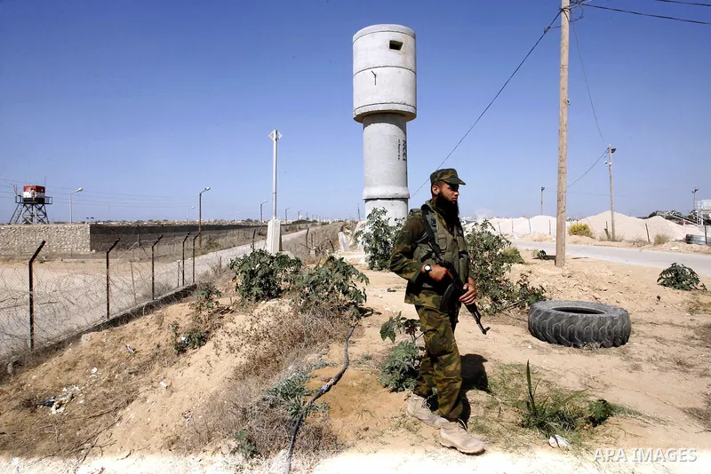 A Palestinian security officer patrols the Palestinian side of the Rafah border crossing in the southern Gaza Strip with Egypt (background) on October 26, 2014. The decision was taken to close the Rafah crossing into the...