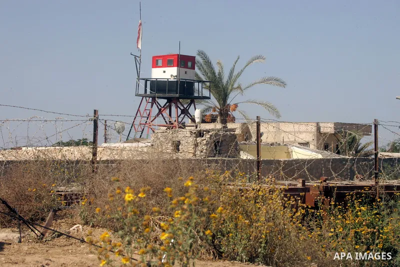 An Egyptian soldier stands on a tower in the Egyptian side of the Rafah border crossing in the southern Gaza Strip as seen from the Palestinian side, on October 26, 2014. The decision was taken to close the Rafah crossin...