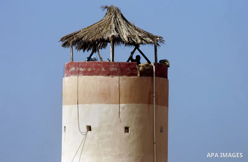 An Egyptian soldier stands on a tower in the Egyptian side of the Rafah border crossing in the southern Gaza Strip as seen from the Palestinian side, on October 26, 2014. The decision was taken to close the Rafah crossin...