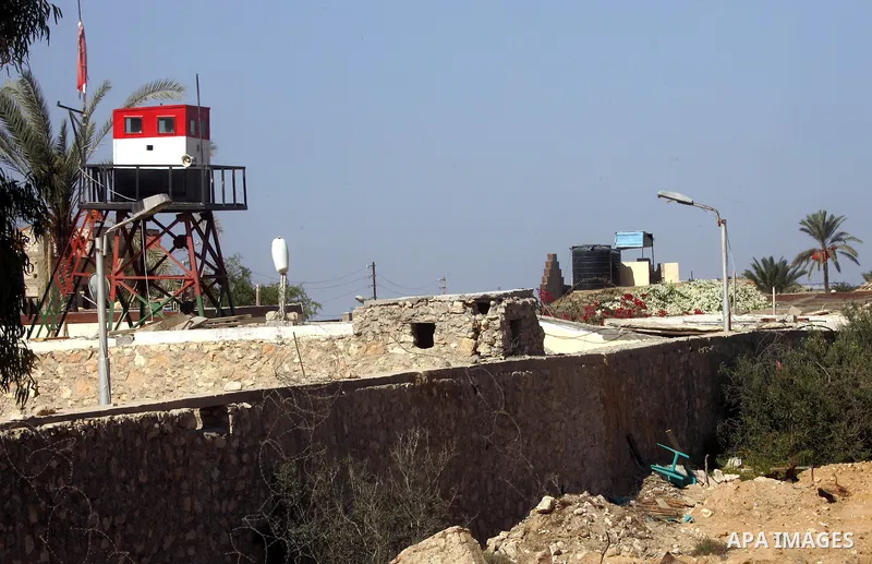 An Egyptian soldier stands on a tower in the Egyptian side of the Rafah border crossing in the southern Gaza Strip as seen from the Palestinian side, on October 26, 2014. The decision was taken to close the Rafah crossin...