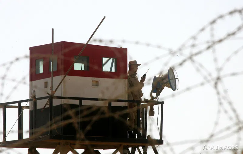 An Egyptian soldier stands on a tower in the Egyptian side of the Rafah border crossing in the southern Gaza Strip as seen from the Palestinian side, on October 26, 2014. The decision was taken to close the Rafah crossin...