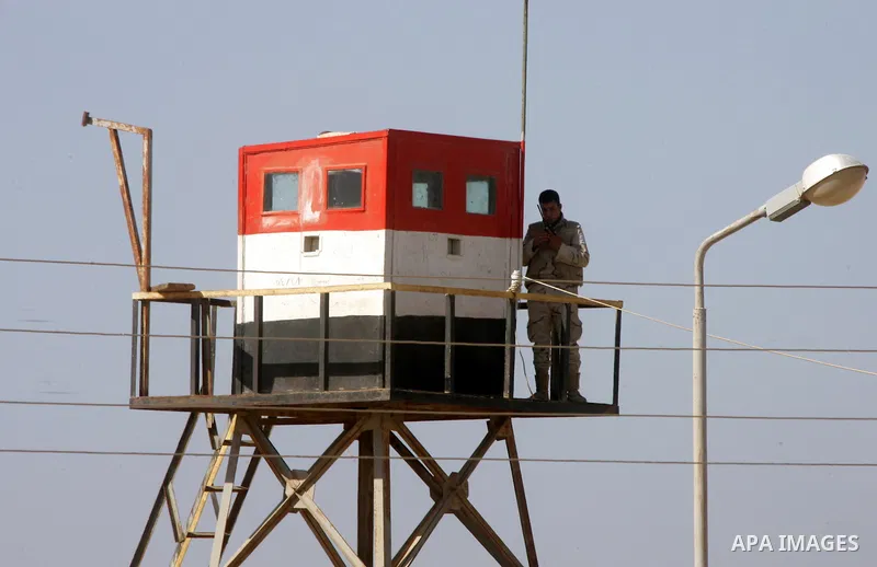 An Egyptian soldier stands on a tower in the Egyptian side of the Rafah border crossing in the southern Gaza Strip as seen from the Palestinian side, on October 26, 2014. The decision was taken to close the Rafah crossin...