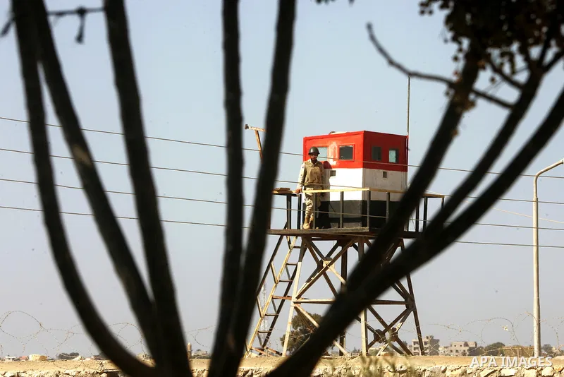 An Egyptian soldier stands on a tower in the Egyptian side of the Rafah border crossing in the southern Gaza Strip as seen from the Palestinian side, on October 26, 2014. The decision was taken to close the Rafah crossin...