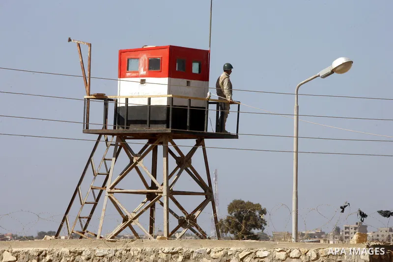 An Egyptian soldier stands on a tower in the Egyptian side of the Rafah border crossing in the southern Gaza Strip as seen from the Palestinian side, on October 26, 2014. The decision was taken to close the Rafah crossin...