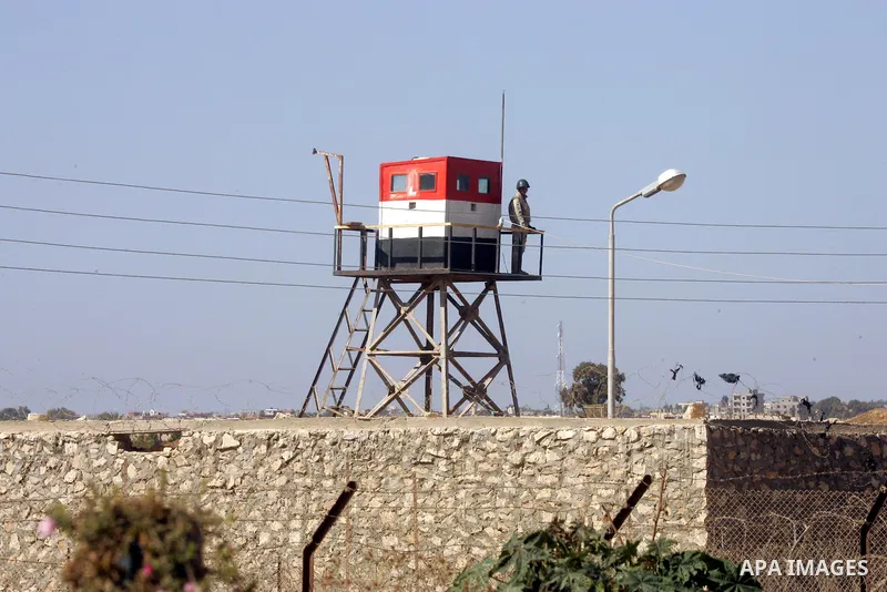 An Egyptian soldier stands on a tower in the Egyptian side of the Rafah border crossing in the southern Gaza Strip as seen from the Palestinian side, on October 26, 2014. The decision was taken to close the Rafah crossin...