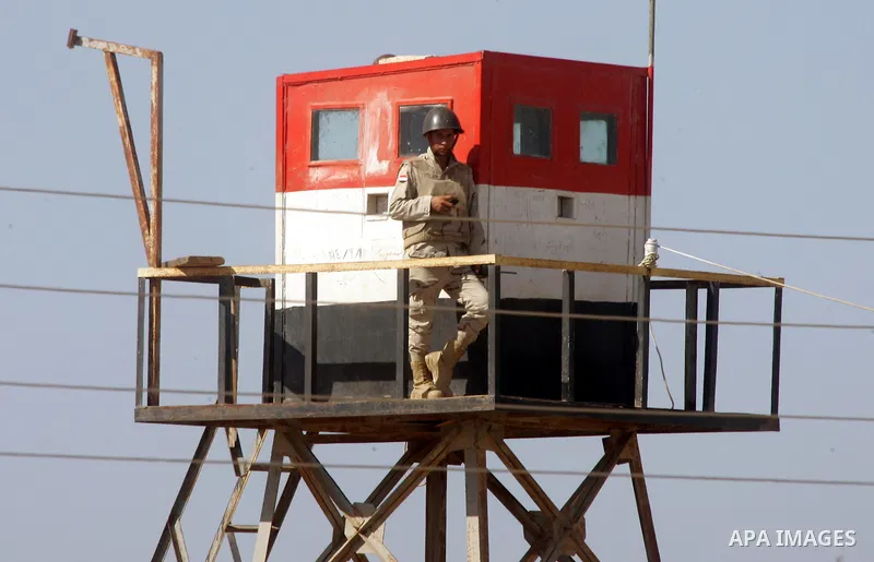 An Egyptian soldier stands on a tower in the Egyptian side of the Rafah border crossing in the southern Gaza Strip as seen from the Palestinian side, on October 26, 2014. The decision was taken to close the Rafah crossin...