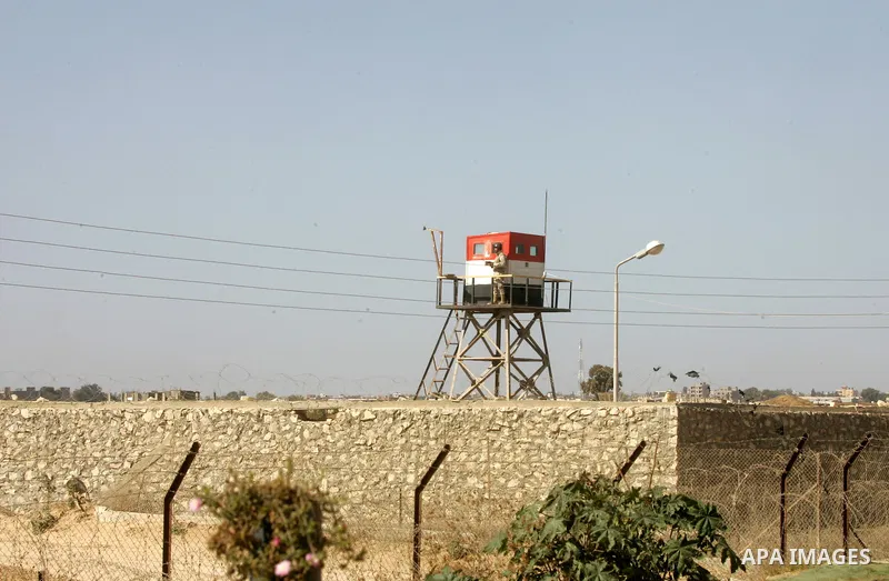 An Egyptian soldier stands on a tower in the Egyptian side of the Rafah border crossing in the southern Gaza Strip as seen from the Palestinian side, on October 26, 2014. The decision was taken to close the Rafah crossin...
