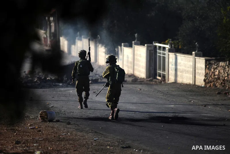 Israeli security forces take position during clashes with Palestinians after funeral Palestinian-American, Orwah Hammad, 14, who was shot dead last Friday during clashes with Israeli army soldiers, at the entrance of Ham...