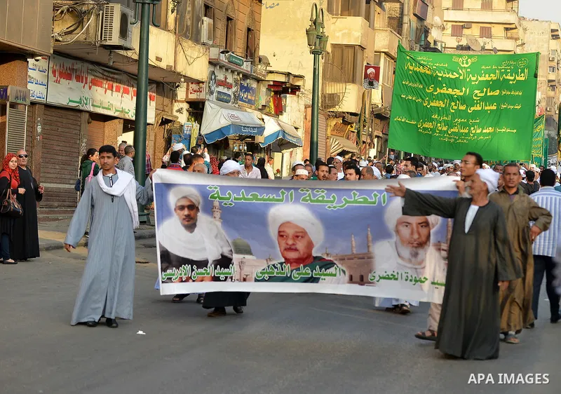 Members of Egyptian sufi muslim group parade the street during a ritual to commemorate the Hijri New Year, also known as Islamic New Year, in Cairo on October 26, 2014. The Islamic year lasts for about 354 days and consi...
