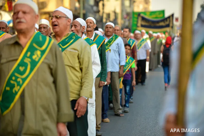 Members of Egyptian sufi muslim group parade the street during a ritual to commemorate the Hijri New Year, also known as Islamic New Year, in Cairo on October 26, 2014. The Islamic year lasts for about 354 days and consi...